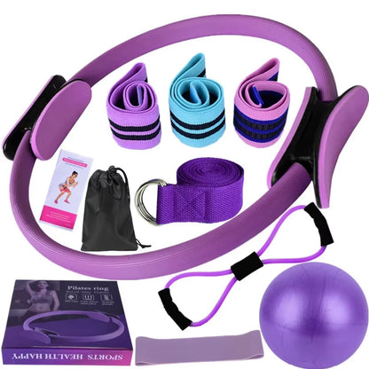 10 piece kit exercise equipment including a Pilates ring, resistance bands, and a ball on a white background.