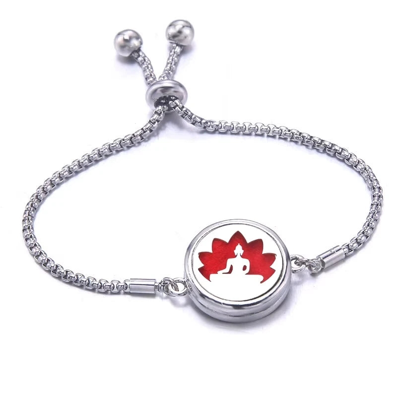 Silver bracelet with a red pad featuring a lotus design on a white background
