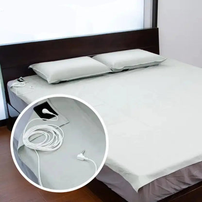 Grounding Sheet on a Queen size bed with connection point magnified - JoyClik