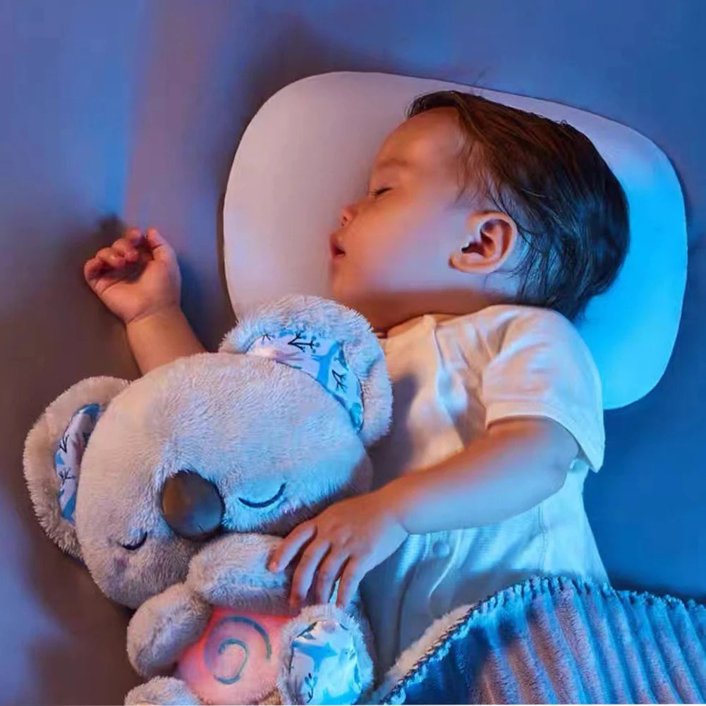 Baby sleeping with a koala in a dimly lit room