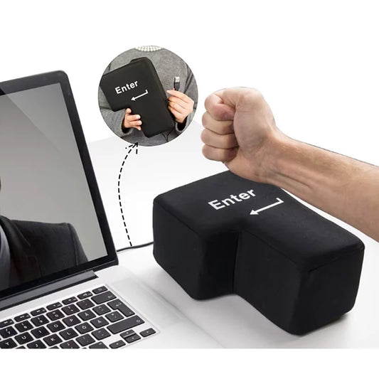 Black Big 'Enter' key with a fist above it, placed on a desk next to a laptop showing an insert of hands holding it and showing the connector.