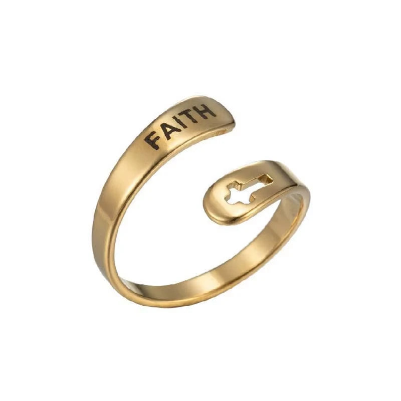 Gold ring with 'FAITH' laser etched on, on a white background