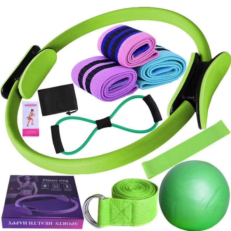 Set of green exercise equipment including a Pilates ring, resistance bands, and a ball on a white background.