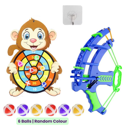 Toy target board set with a monkey-shaped target, green and blue bow, six colorful sticky balls and mounting hook on a white background.
