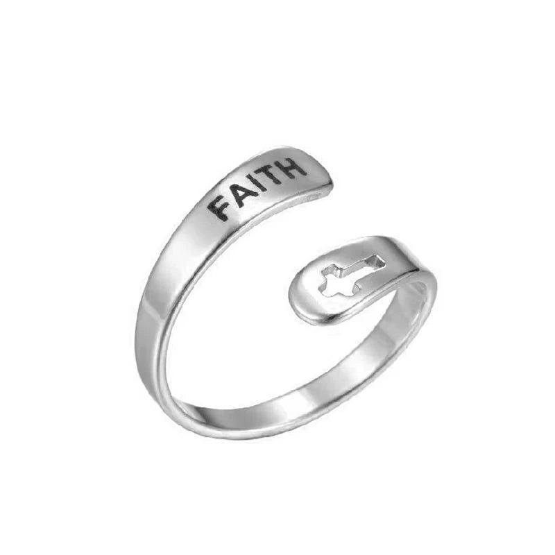 Silver ring with 'FAITH' laser etched on, on a white background