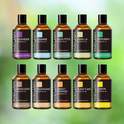 Collection of MayJam essential oil bottles on a green gradient background