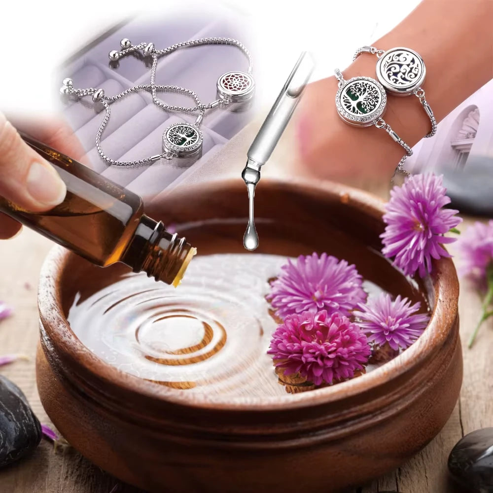 Bowl with flowers and a bottle of oil, surrounded by aromatherapy bracelets indicating essential oil use with bracelet