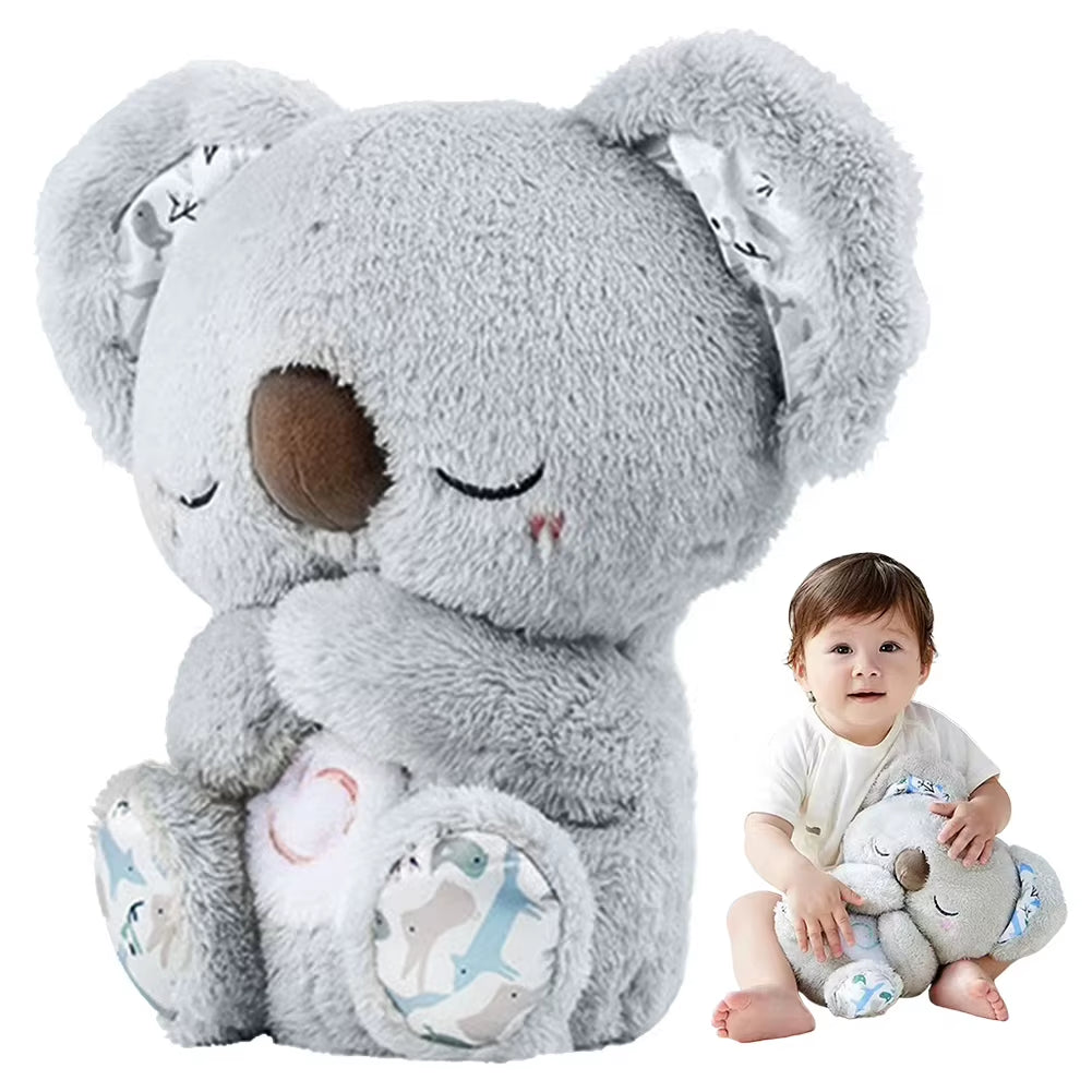 Grey plush koala with a baby holding it on a white background