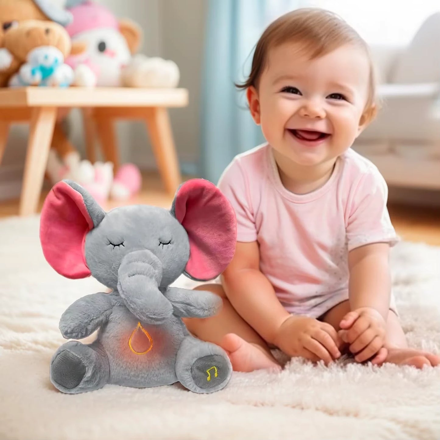 Baby sitting on a carpet with a plush breathing elephant toy