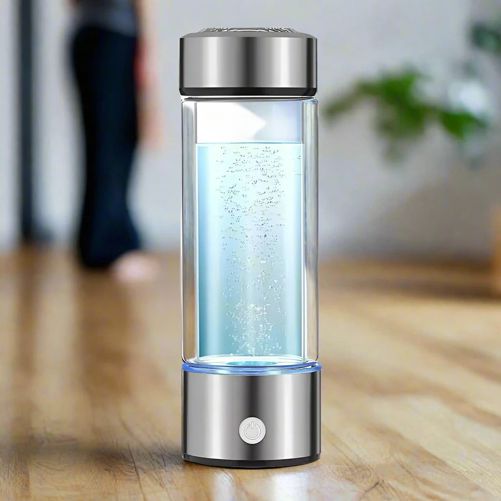 Hydrogen water bottle with bubbling water on a wooden surface