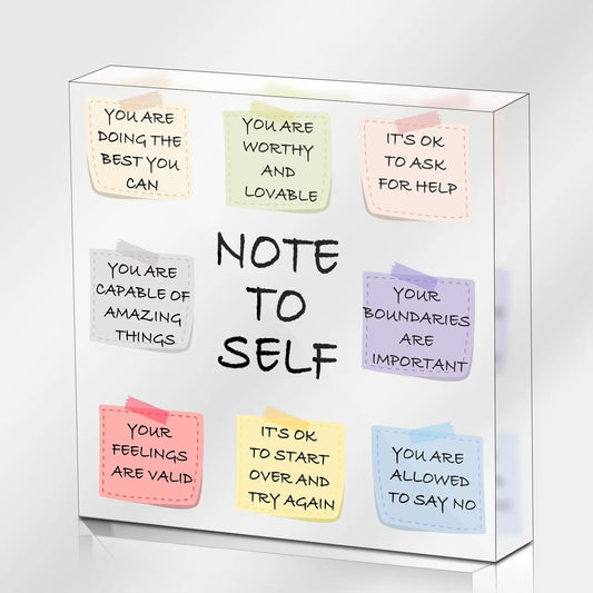 A square acrylic plaque with various colorful sticky notes featuring daily positive affirmations.