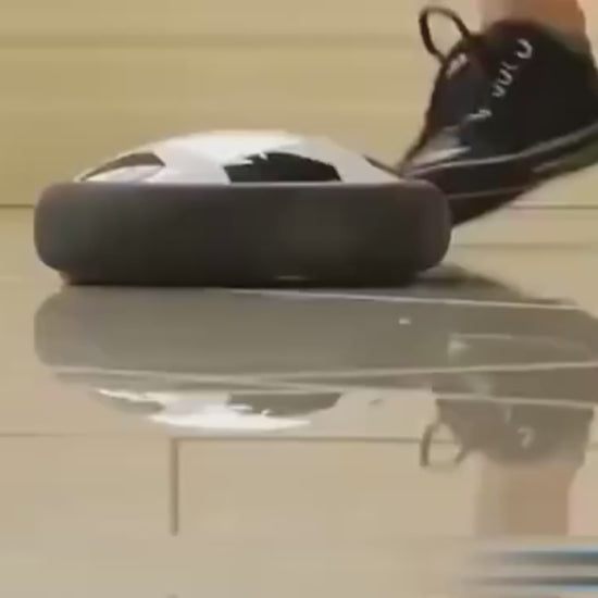 kids playing with the hover soccer ball in the house and passage