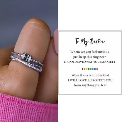 Stacked silver rings on a finger with sentimental message text overlay