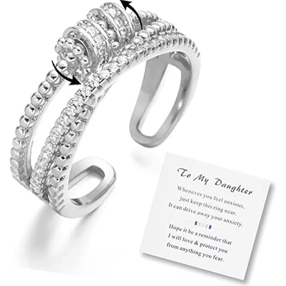 Silver ring with a message card on a white background