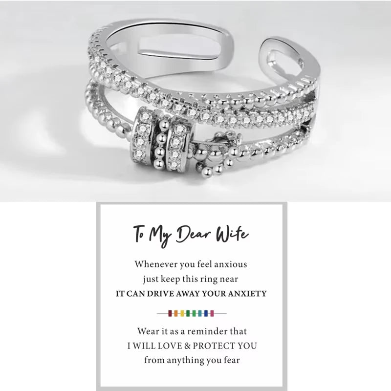 Silver ring with text on a white background