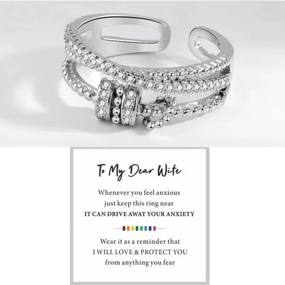 Silver ring with text on a white background