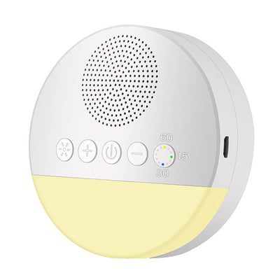 close up of round usb white noise machine with control buttons and usb port with light on on a white background